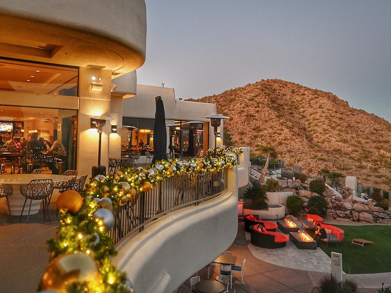 outdoor patio with holiday lights and ornaments